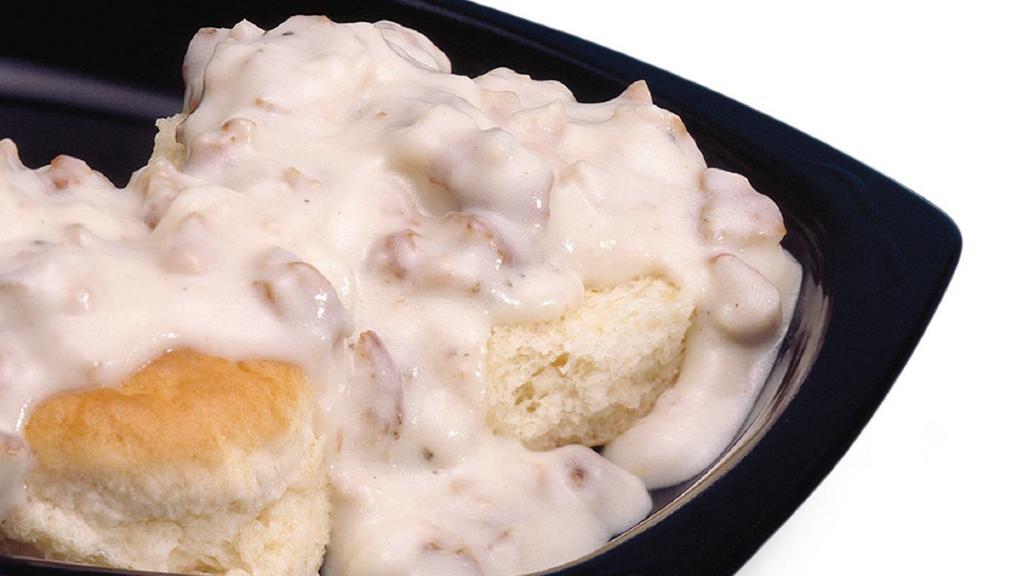 Biscuit & Gravy · One golden buttermilk biscuit cut in half and covered with country-style sausage gravy.