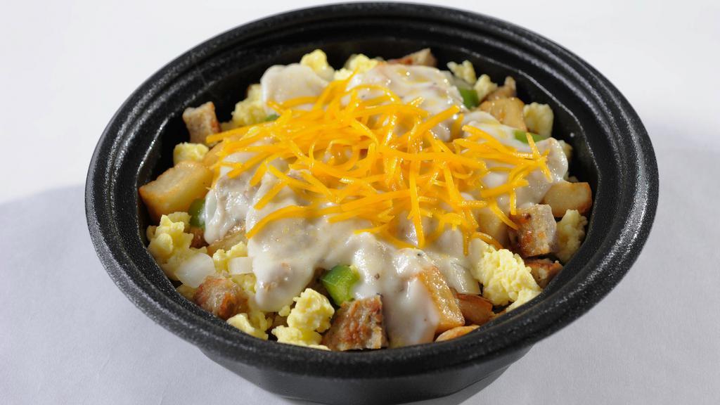 Country Breakfast Bowl · Scrambled eggs, sausage, green peppers, and onion, cheddar cheese, and hash brown potatoes mixed in a bowl and topped with sausage gravy and cheese.