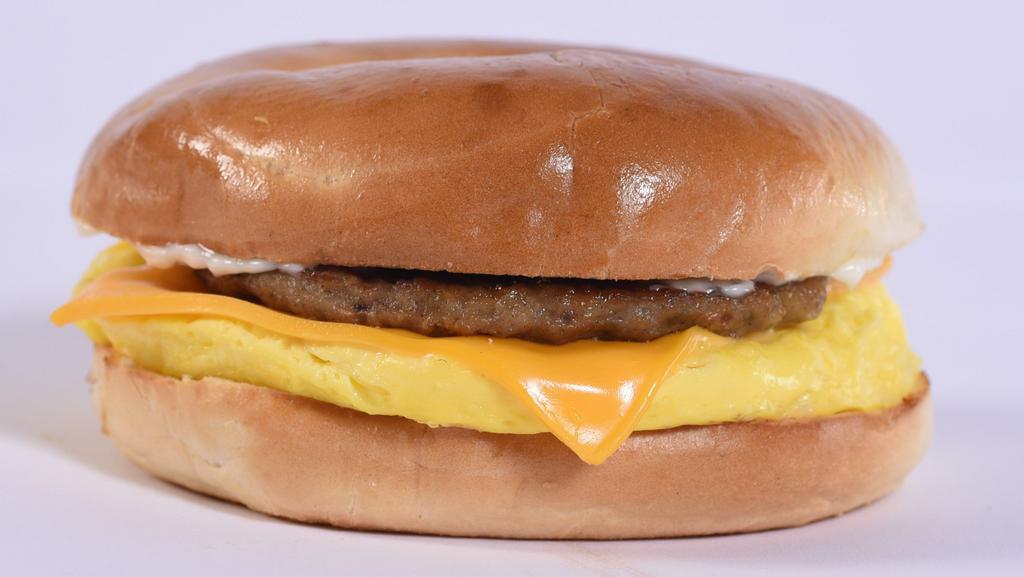 Bagel Bun Sandwich · Sausage patty or bacon, egg patty, American cheese and mayonnaise, all on a soft bagel bun.