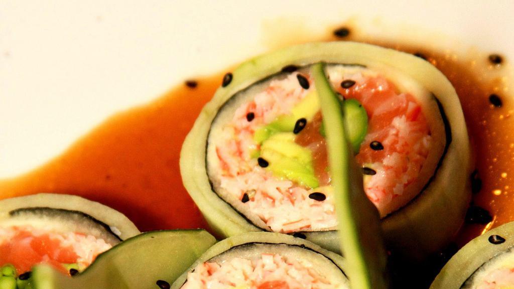 Summer · Crab mix, salmon, asparagus, and avocado wrapped with cucumber, topped with icon garlicky sashimi sauce.