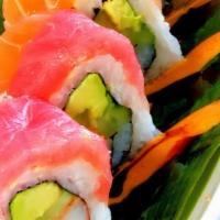 Rainbow · Crab, avocado, and cucumber roll topped with tuna, salmon, yellow tail, white fish, shrimp, ...