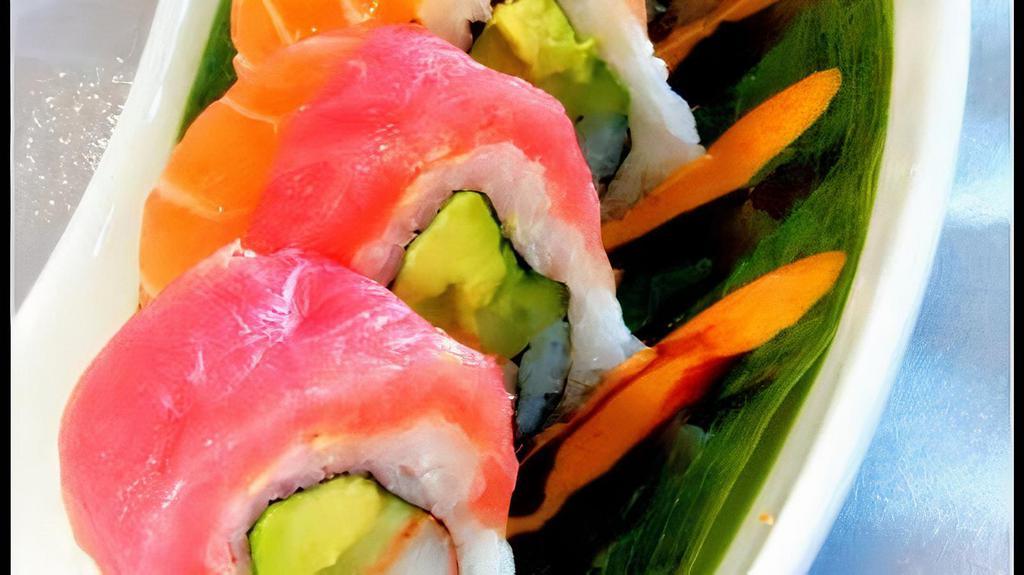Rainbow · Crab, avocado, and cucumber roll topped with tuna, salmon, yellow tail, white fish, shrimp, and avocado, served on spicy sweet sauce.