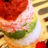 Icon “Tower” · Layer of sushi rice, avocado, crab mix, and your choice of spicy tuna or salmon mixed with c...