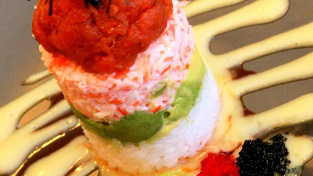 Icon “Tower” · Layer of sushi rice, avocado, crab mix, and your choice of spicy tuna or salmon mixed with caviar and creamy spicy wasabi sauce.