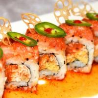 Lotus On Fire · Spicy salmon, crab mix, and tempura crispy roll, topped with spicy yellow tail, fried lotus ...