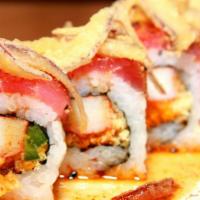 Cafe Icon Signature Roll · Crab stick, jalapeno, tempura crispy, and masago roll topped with your choice of peppered tu...