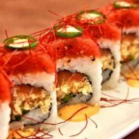 Spicy Baby · Salmon, jalapeno, and tempura crispy roll, topped with extra spicy tuna drizzled with spicy ...