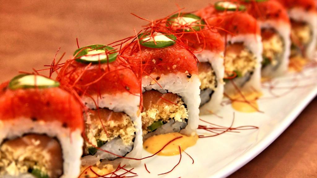 Spicy Baby · Salmon, jalapeno, and tempura crispy roll, topped with extra spicy tuna drizzled with spicy sweet mayo and imported Japanese saffron.