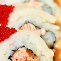 Snow White · Spicy salmon, cucumber, and crab mix roll, topped with escolar and red tobiko caviar, served...