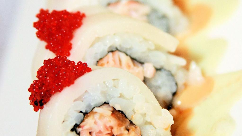 Snow White · Spicy salmon, cucumber, and crab mix roll, topped with escolar and red tobiko caviar, served on spicy wasabi mayo.