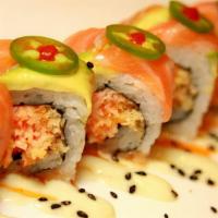 Godzilla · Spicy crab mix and tempura crispy roll topped with avocado, salmon, and jalapenos drizzled w...