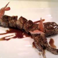 Scorpion · Crab mix, avocado, and tempura crispy roll topped with a fried “jumbo” soft shell crab with ...