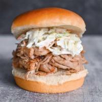 Lolo'S Pulled Pork · Pulled pork marinated in vinegary Swine Wine and topped with creamy slaw