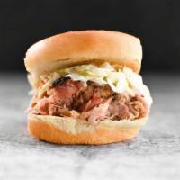 Kids Lolo'S Pulled Pork · Pulled pork marinated in vinegary Swine Wine and topped with creamy slaw, served with one ki...