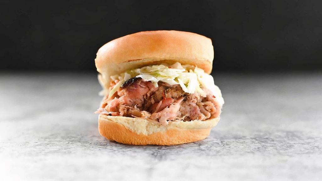 Kids Lolo'S Pulled Pork · Pulled pork marinated in vinegary Swine Wine and topped with creamy slaw, served with one kids’ side and drink
