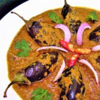 Bagara Baigan - Vegan · Small  eggplant cooked in a thick gravy of onions, tomatoes sauce