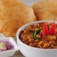 Chole Bhatura · Chickpeas cooked in a  brown curry sauce in  your choice of protein