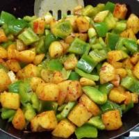 Aloo Capsicum - Vegan · Potatoes and Green Bell Peppers cooked in tempering spices.