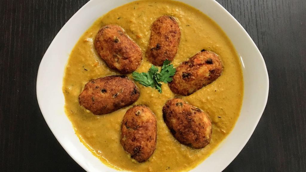 Malai Kofta (Vegan Option) · Soft and creamy homemade cottage cheese dumpling stuffed with dry fruits, cooked in a mild sauce.