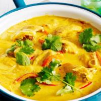 Mango · Mango curry sauce &  mild spices cooked in Your Choice of add-on