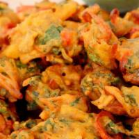 Khel Pakora · Assorted vegetables deep fried in mildly-spiced chickpea flour.