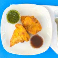 Samosa Veg. 2Pcs - Vegan · Cumin flavored potatoes and peas wrapped in a flaky pasty, served hot and fresh with tamarin...