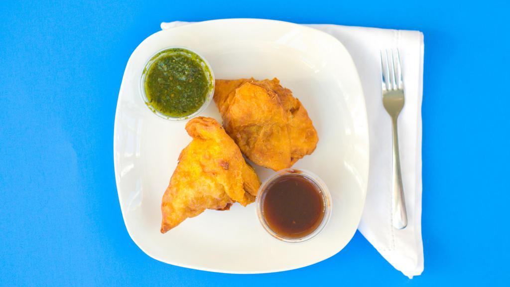 Samosa Veg. 2Pcs - Vegan · Cumin flavored potatoes and peas wrapped in a flaky pasty, served hot and fresh with tamarind and mint sauce 2 Per Order