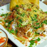 Samosa Chat · Chaat made with samosa, chickpea curry, various chutneys and spices