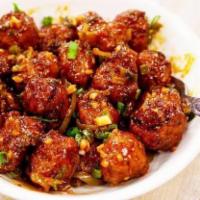 Veg Manchurian · House special golden Vegetable dumplings in mildly spiced soya garlic sauce cooked with fres...