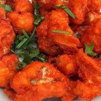 Gobi 65 · Street food -  appetizer made with Cauliflower, battered in flour, curry leaves and spices