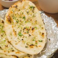 Garlic Naan · Oven Baked  Flat Bread infused with an irresistible garlic flavor.