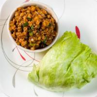 Lettuce Wraps · Minced chicken, water chestnuts and green onions stir-fried in a light brown sauce.