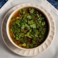 Tom Yum · Lemongrass, straw mushrooms, green onions, coriander leaves, lime juice, and chili paste.