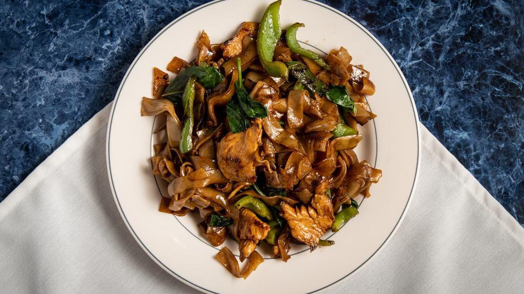 Drunken Noodle · Thick rice noodles with fresh Thai basil leaves and green peppers topped with raw bean sprouts.
