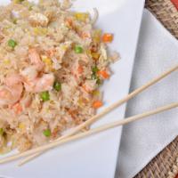 Kow Pad · Gluten-free. Thai style fried rice with eggs, onions, peas, and carrots.