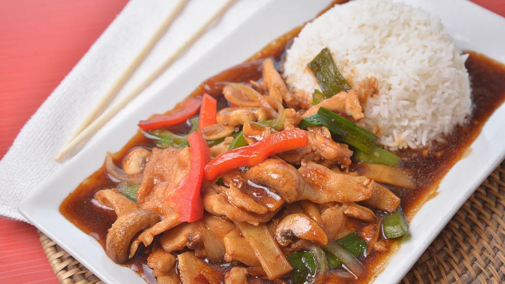 Pad Prik · Green peppers, white onions, green onions, bamboo shoots, and mushrooms stir fried in a brown sauce.