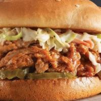 Sweet 'N Smoky Pulled Pork Sandwich · Pulled pork marinated with our sweet 'n smoky BBQ sauce on a bed of pickles, topped with cre...