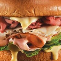 Butcher Block Meal · The legend returns…slow roasted beef, smoked turkey and hickory ham piled high on a brioche ...