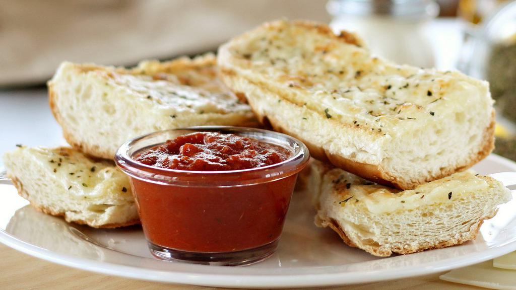 Garlic Cheese Bread · Served with red sauce.