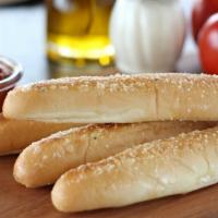 Breadsticks · Rolled and baked at our oven hearth bakery in st. Paul. Served with red sauce.
