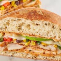 Spicy Southwest Chicken · Grilled chicken, roasted corn, poblano and black bean relish, pepper jack, avocado and chipo...