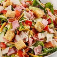 Chef Salad · Diced Turkey and ham, bacon, cheddar-jack, tomato, croutons and cucumber on mixed greens.