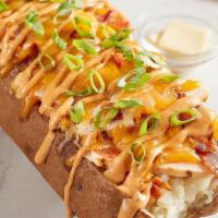 Chipotle Chicken & Bacon Spud · Grilled chicken, bacon, cheddar-jack, chipotle ranch and green onion.