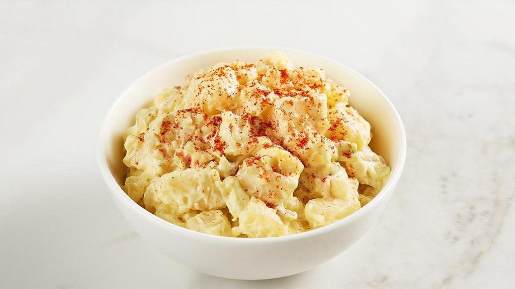 Potato Salad · Southern style potato salad with chunks of potatoes blanketed with our creamy mustard and egg dressing.