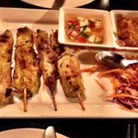 Chicken Satay · Grilled marinated chicken. Served on skewers with peanut sauce and cucumber sauce.