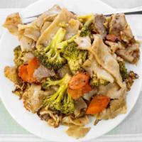 Pad See Ew · Big noodles stir-fried with cabbage, broccoli, carrots, and egg in a sauce.