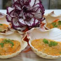 Baked Scallops · Buttery sea scallops baked in garlic aioli.