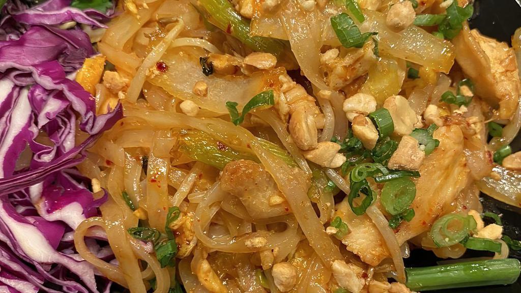 Pad Thai · Rice noodle stir fry made to order with choice of meat or seafood, scrambled egg, peanut, bean sprouts white onion & scallions in homemade tamarind sauce and lime garnish.