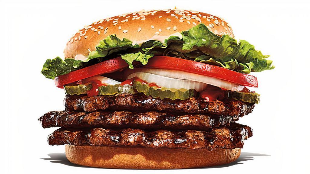 Triple Whopper · Three ¼ lb* flame-grilled beef patties with juicy tomatoes, crisp lettuce, creamy mayonnaise, ketchup, crunchy pickles, and sliced white onions on a toasted sesame seed bun. *Weight based on pre-cooked patty.