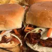 Pulled Pork Jackfruit Sliders · Marinated BBQ jackfruit with carrot, topped with a tangy and sweet slaw, on 3 slider buns, w...